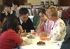 A group of international students talking with an advisor